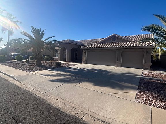Garage - Three car garage with door openers