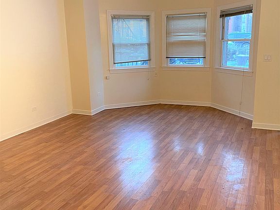 Living Room With Hardwood Floors and large Alcove