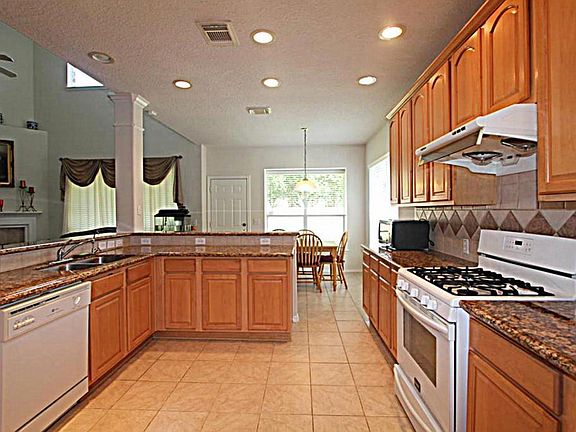 Kitchen with Granite Counter tops and breakfast bar