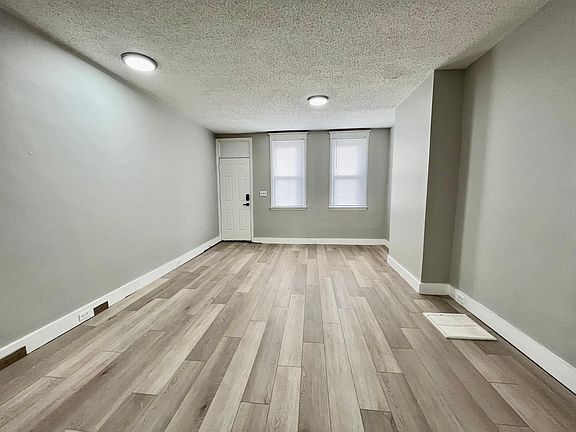 big living room and dinning room with all new with oat floor.