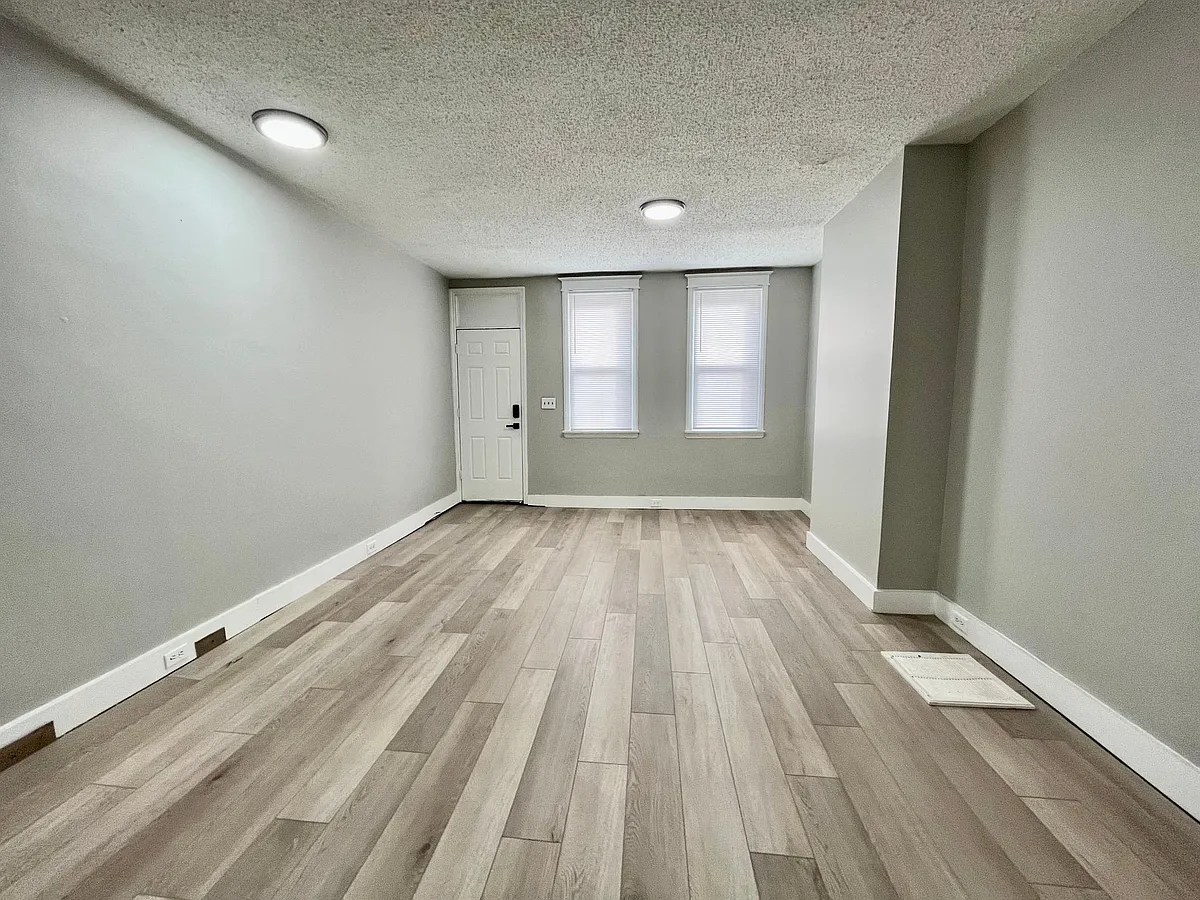 big living room and dinning room with all new with oat floor. - 619 Sigel St