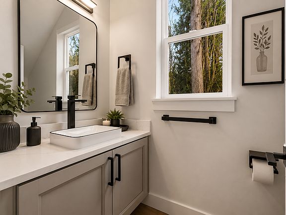 Downstairs powder bathroom. 

Photos may include AI-generated virtual staging to help visualize the home's potential. Finishes and layout remain unchanged.