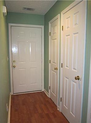 Hallway with coat closet