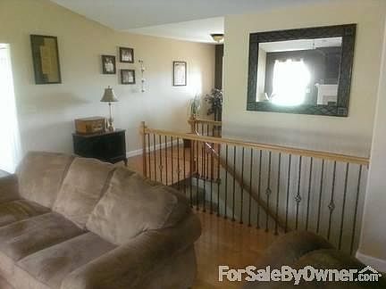 Living room
						:
						Nice foyer leading to front door with side lights. Wrought iron staircase