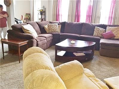 Large family room leads into living room.