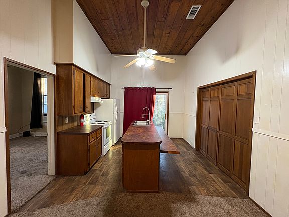Tall, beautiful ceilings. Door on left leads to master, doors on right open up to your laundry/bonus room!