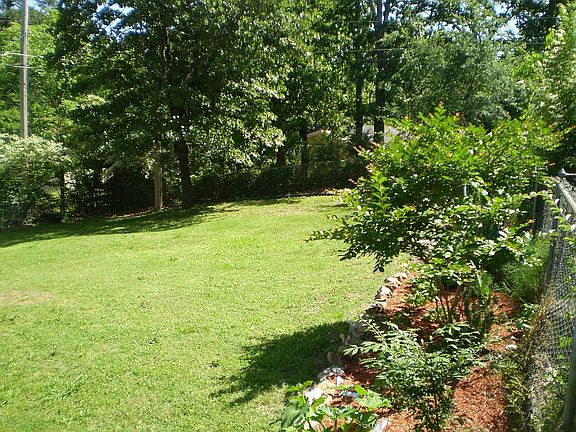 Large, fully fenced backyard.