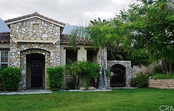 Access To Rear Grounds Through The Iron- Arched Door. Excellent for Entertaining
