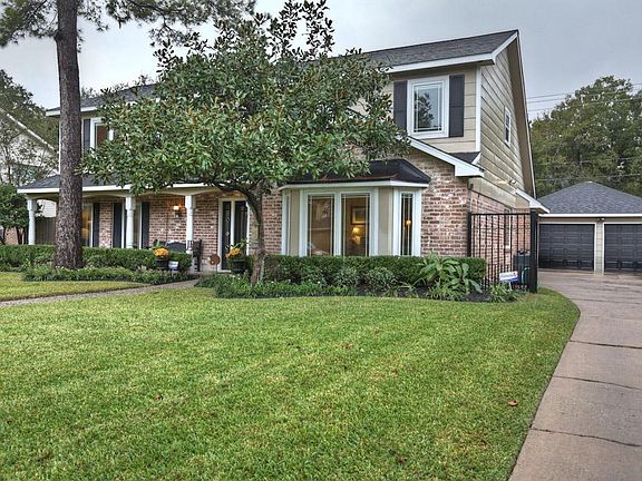  Detached garage with covered walway to the house. Well maintained home with hardiplank and new Pella windows.