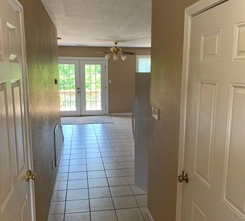Entryway continues into open concept - bright and airy kitchen and living room