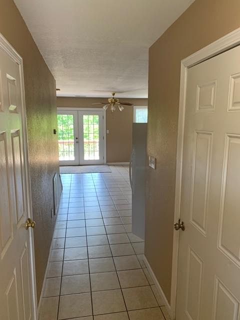 Entryway continues into open concept - bright and airy kitchen and living room