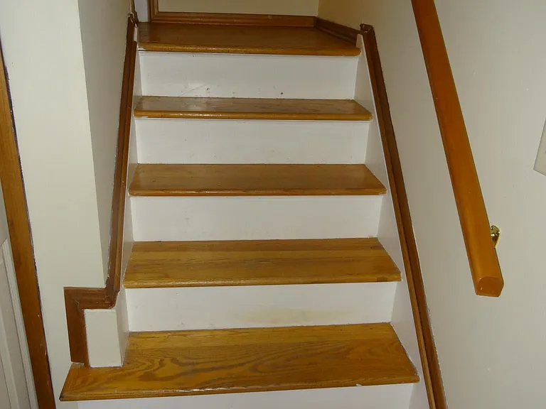 Hardwood stairs, easy clean: no carpets to maintain.