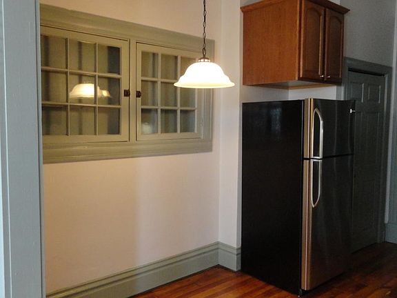 Cute exterior window has been "repurposed" into dish storage