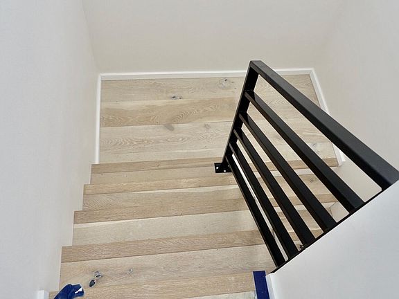 Stairs to bedrooms and bathroom on lower level