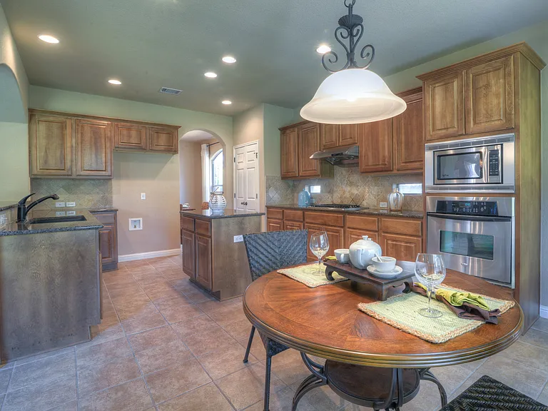 Stainless steel appliances in kitchen.