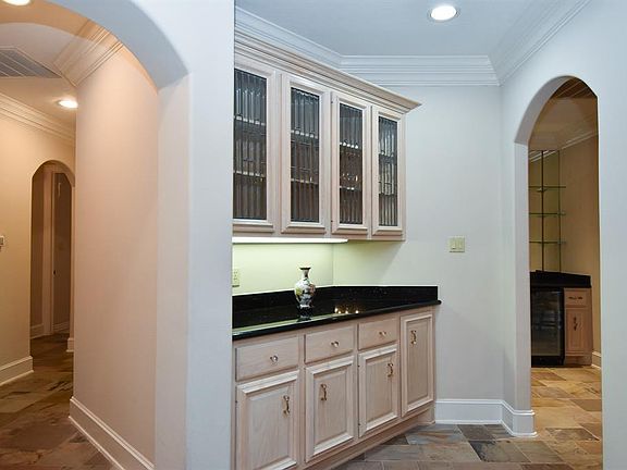 A butler's pantry with leaded glass doors and great cabinetry is the perfect serving spot.