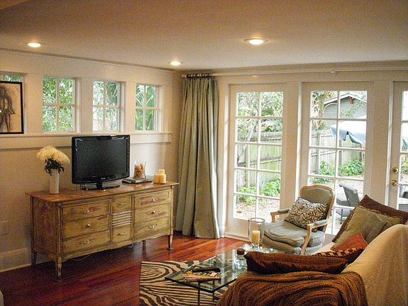 Family room adjacent to kitchen with French doors to backyard
