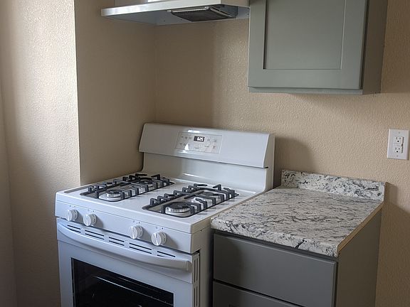 New range with new exhaust fan and new cabinets