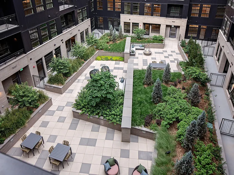 Well-manicured outdoor courtyard with social seating