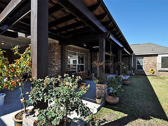 ...back.  Large, wrap-a-round and covered back patio is an extension of the home. Enjoy morning coffee / tea while planning the day here.