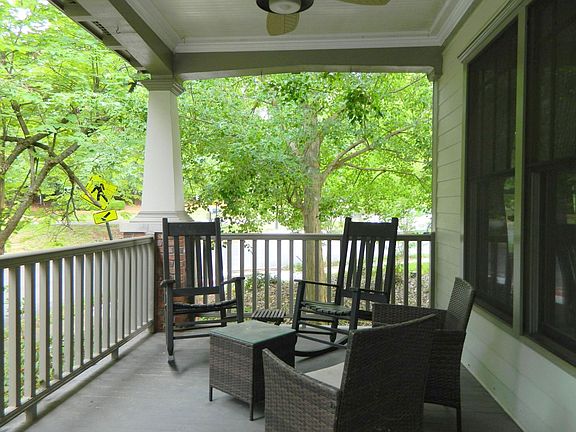 Outdoor living. Large front porch with ceiling fan and an unobstructed view of a park. Great for entertaining