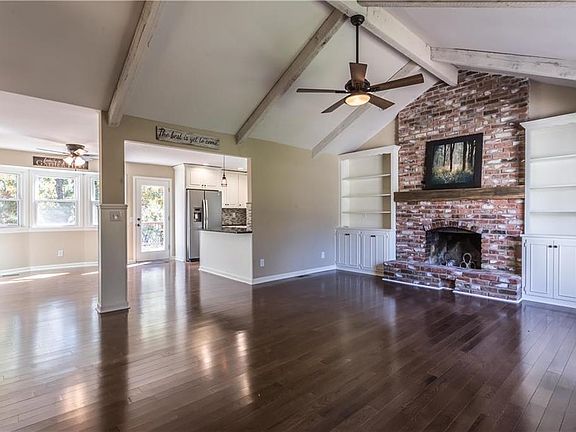 Brand new solid oak 3 1/4" wide hardwoods flow thru entire main living space and master suite.  Open concept and ample windows b