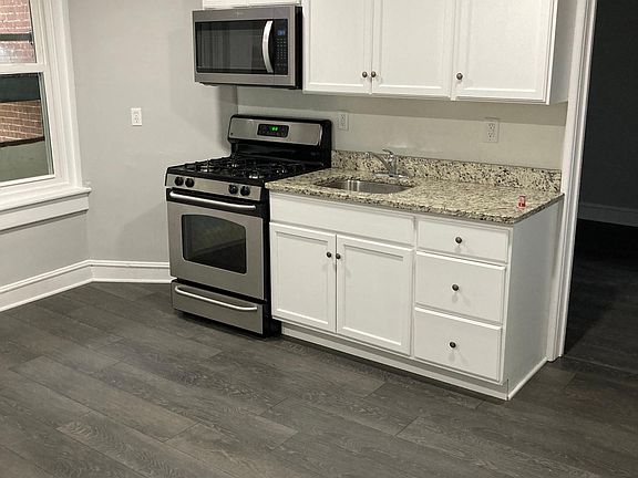 Large, recently remodeled kitchen with updated cabinets, granite counters, and stainless steel appliances