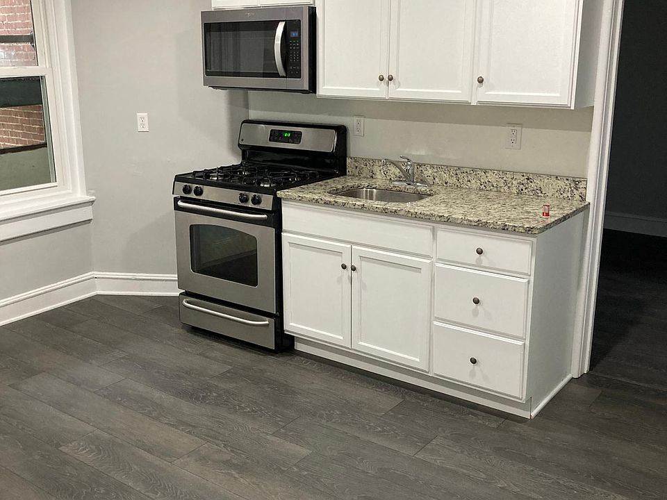 Large, recently remodeled kitchen with updated cabinets, granite counters, and stainless steel appliances