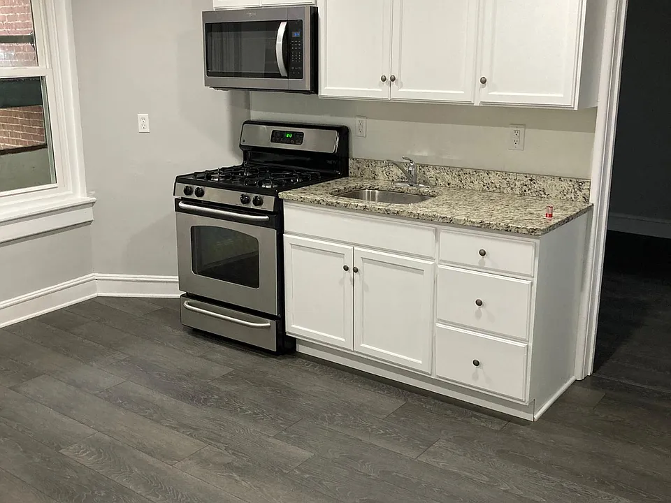 Large, recently remodeled kitchen with updated cabinets, granite counters, and stainless steel appliances