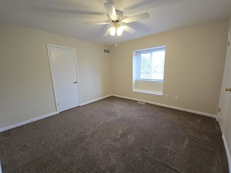 Main bedroom with two closets - one walk in and one with additional built in storgage.