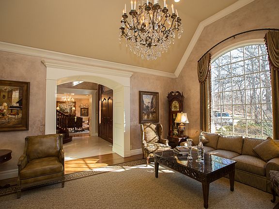 Breathtaking chandelier, extensive trim moulding and sweeping arches.