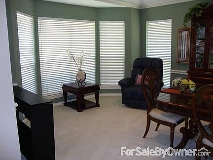 Dining/Sitting area
						:
						This is looking out the front of the house.