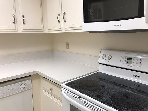 Kitchen with a brand new granite countertop, new sink and faucets, and plenty of storage