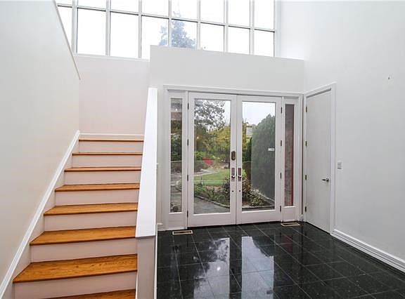 Two story entry with marble floor