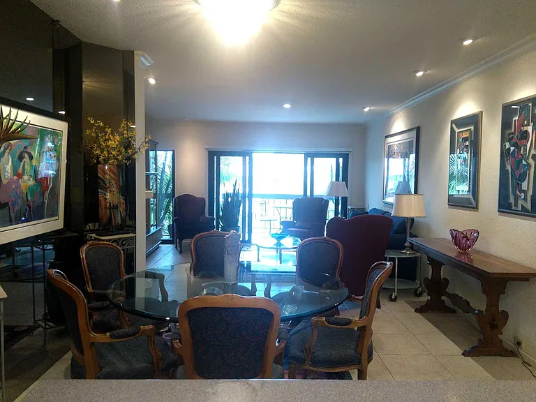 VIEW FROM DINING AREA TO LIVING ROOM. THE CONDO HAS BEEN RECENTLY PAINTED IN ALL NEURTRAL TONES