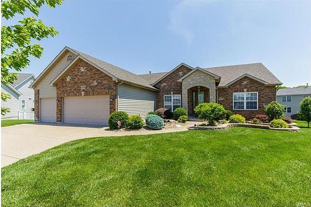 What a beautiful front elevation. The 3 car garage was built 2 feet deeper