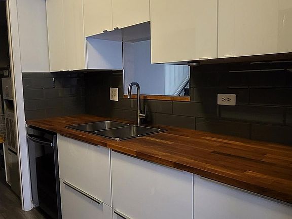 Butcher block countertops and premium slide out, soft close cabinets