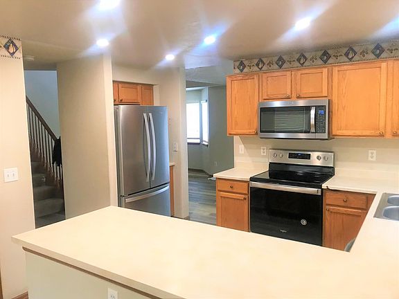 Kitchen opens to dining room and entryway