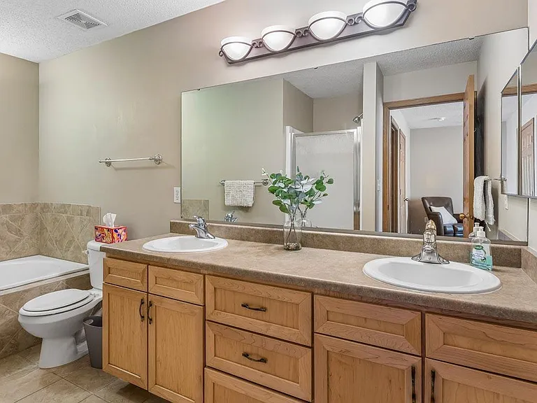 Spacious vanities provide room to spread out and simplify busy morning routines.