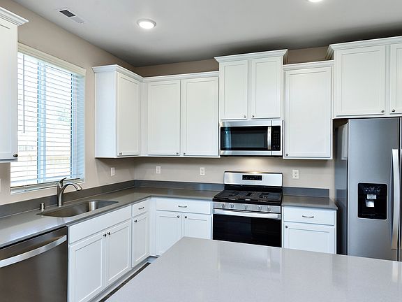 The chef ready kitchen comes with stainless steel appliances and granite countertops