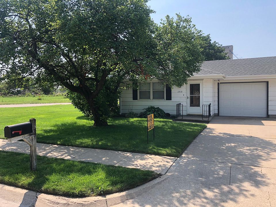 Front entry and attached garage.