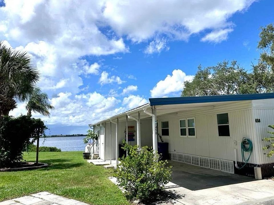 Front of house with carport