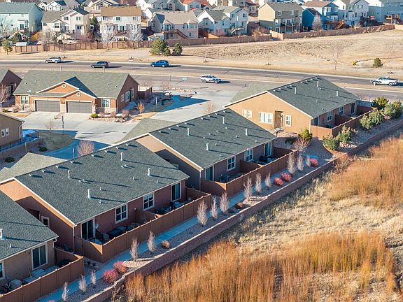 Backs to open space, not a busy street with traffic noise