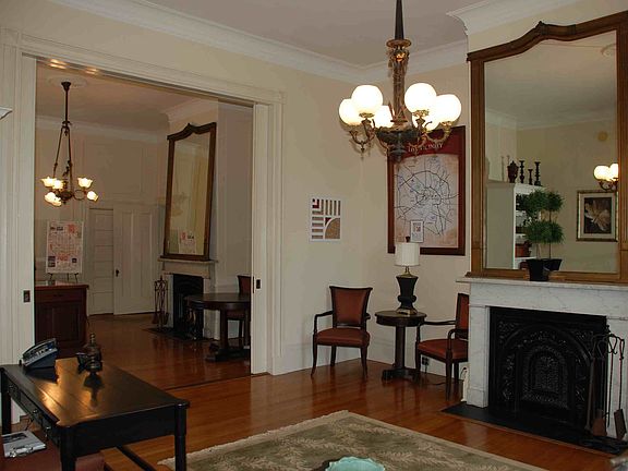 Exceptional living and dining rooms with original fixtures.