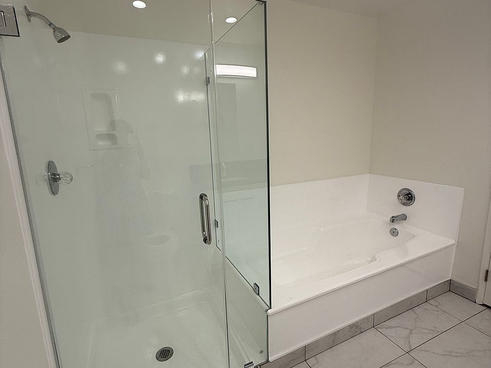 With walk-in shower and bath tub