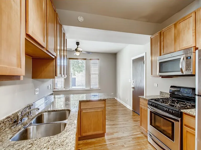 Kitchen backsplash has been added per prior photo.