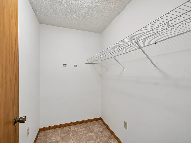 Maximize your storage potential with this spacious closet at Mill Pond Apartments. Enjoy organized living and easy access to all your belongings. Elevate your lifestyle and make this your new home today!
