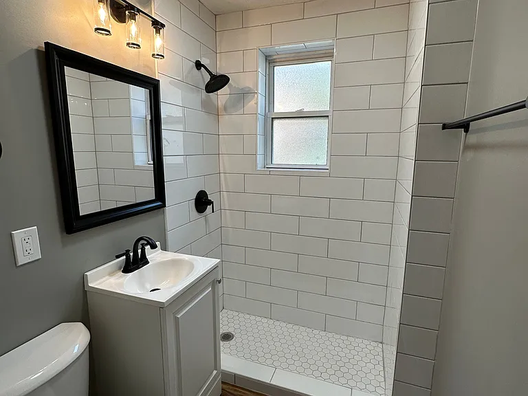 Modern bathroom located in a unit at University Court.
