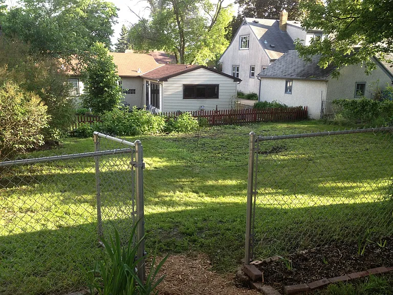 Closer look of fenced in backyard