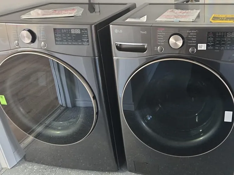 Dedicated laundry nook with side-by-side front-loading washer and dryer for convenient in-home laundry